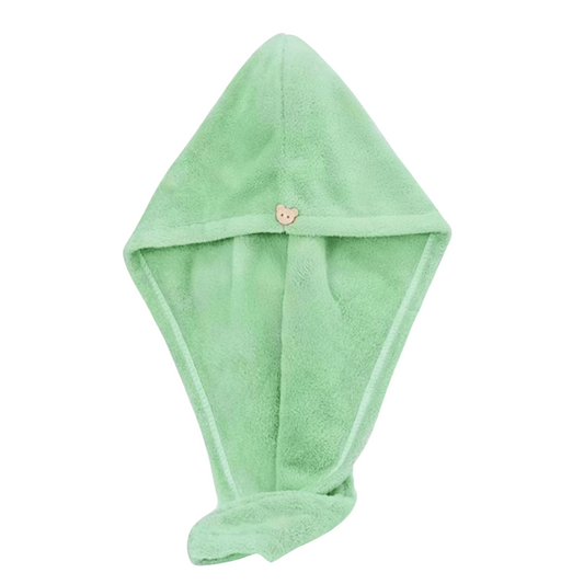 Green hooded towel with a teddy bear button on a white background