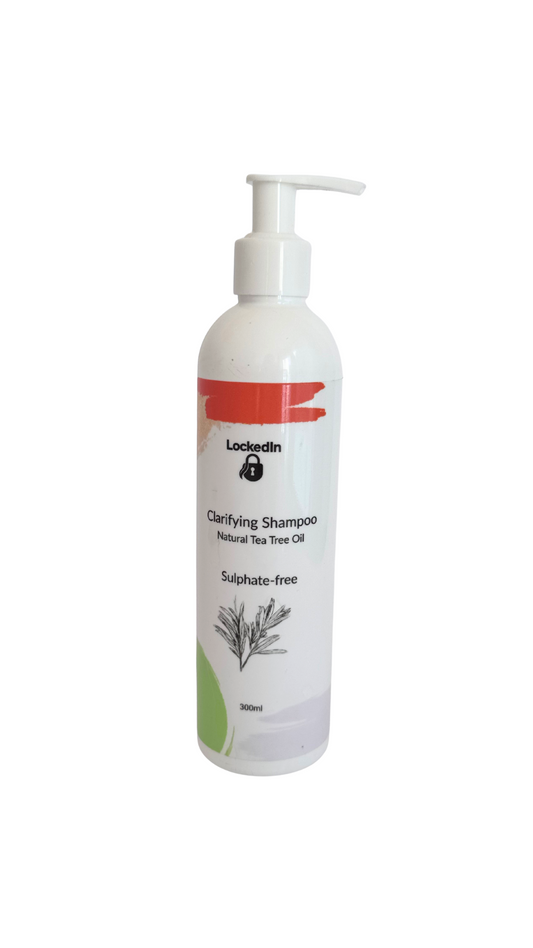 Bottle of clarifying shampoo with tea tree oil on a white background